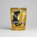 Gold package of PurrSnickity cat food on a wooden surface with a blurred background